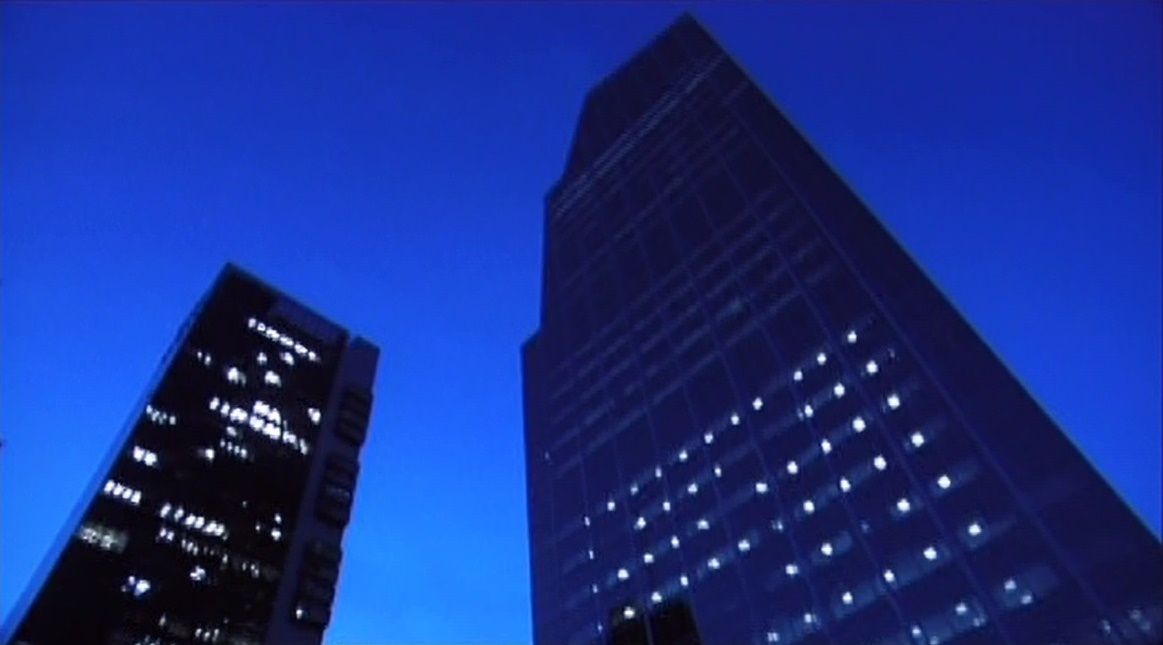 Night view of illuminated skyscrapers — from Transpoiesis Portal
